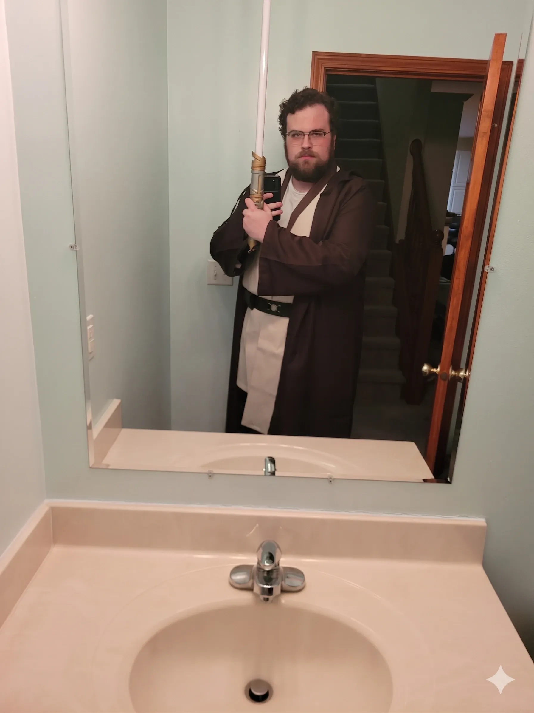 Jedi costume with lightsaber